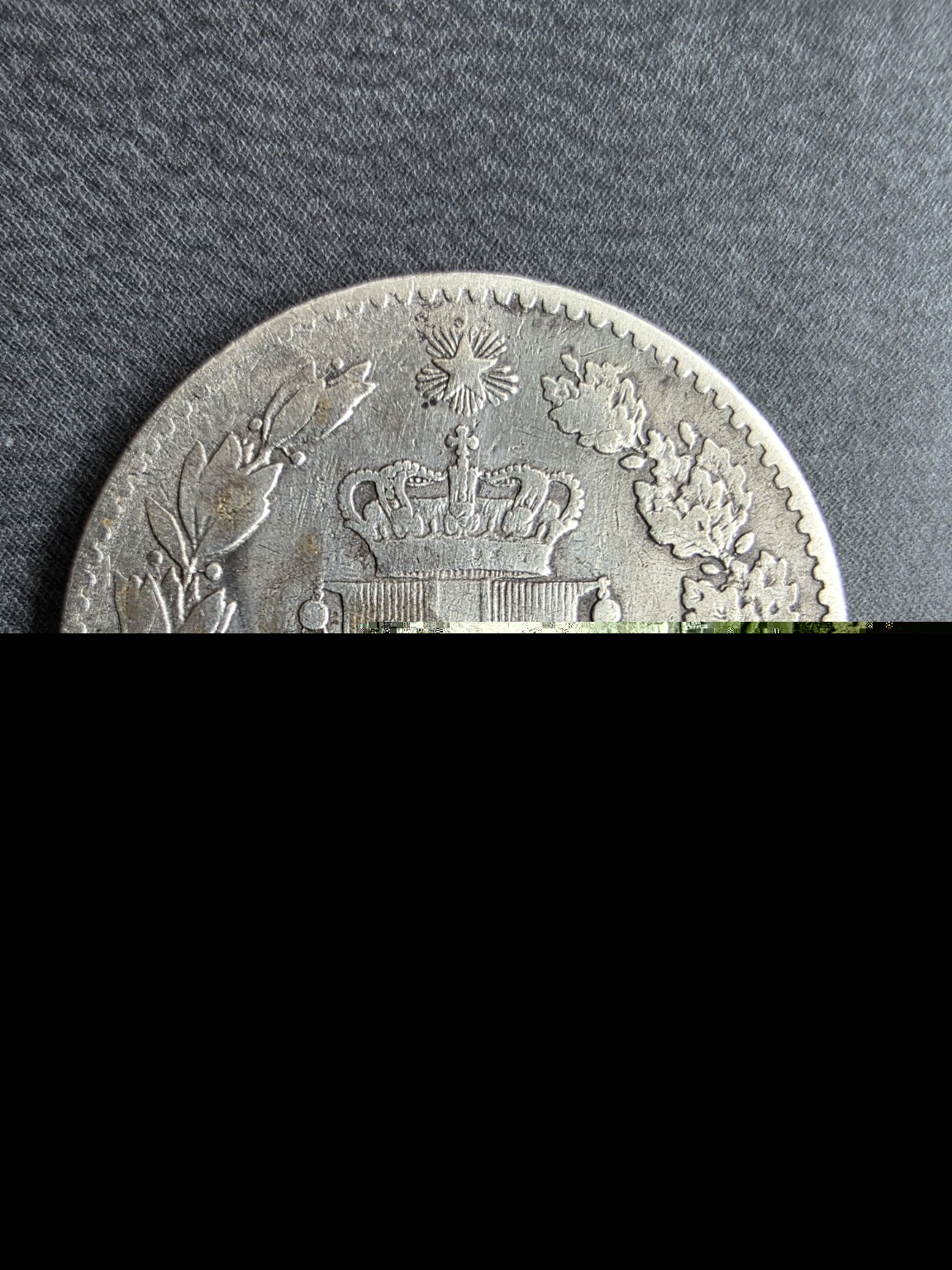 Escudo de Saboya y valor de 1 lira en la moneda italiana de 1887