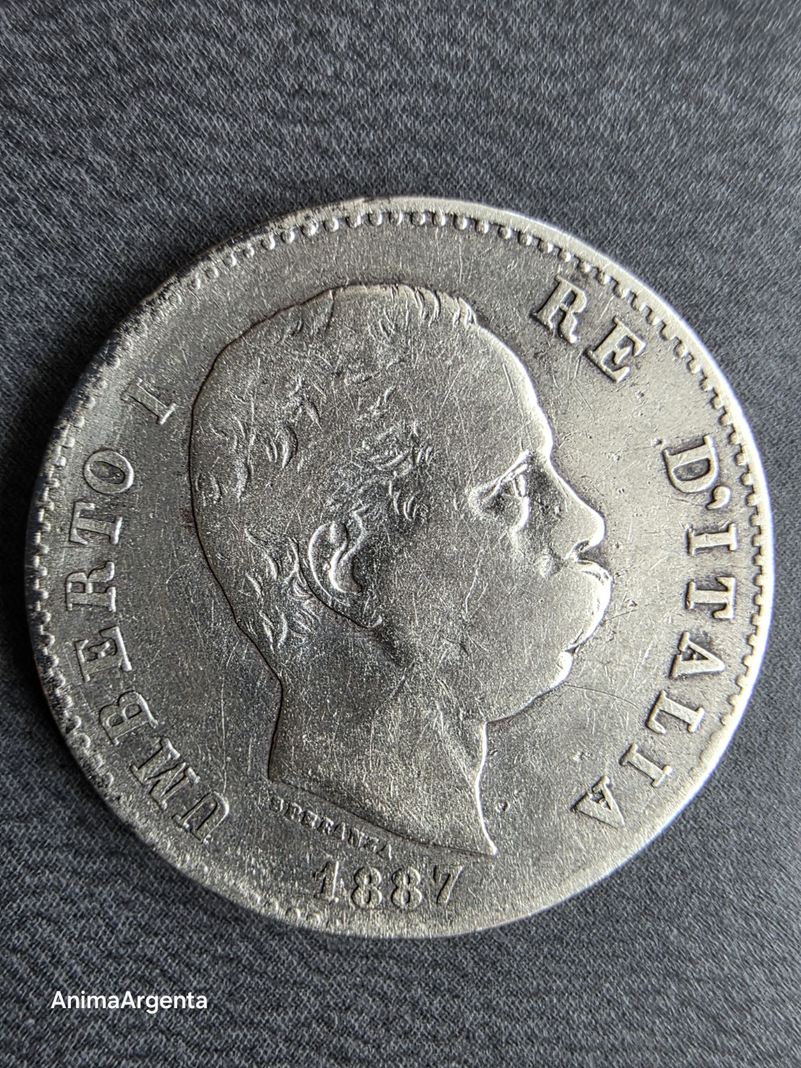 Retrato de Umberto I en la moneda italiana de 1 lira de 1887